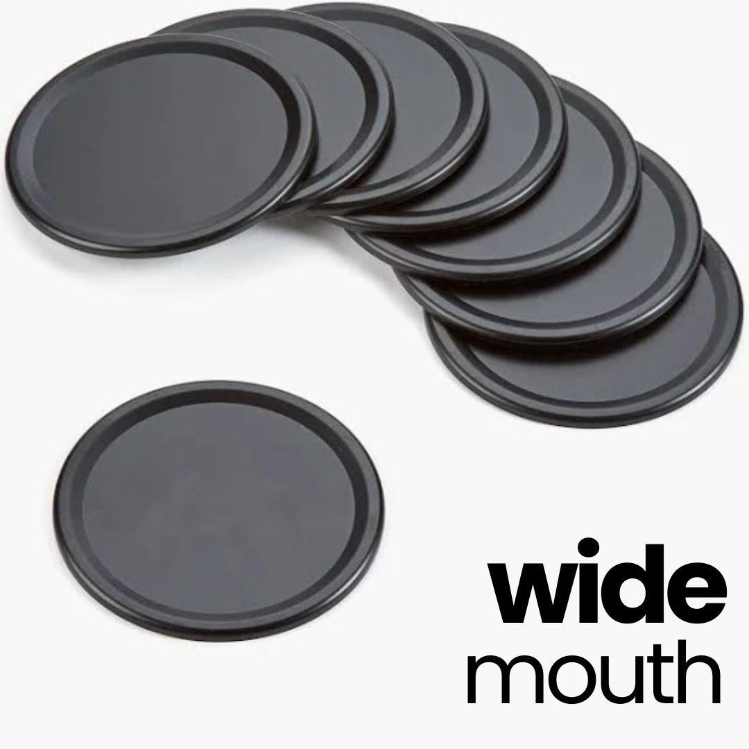 Stack of black wide-mouth plastic lids.